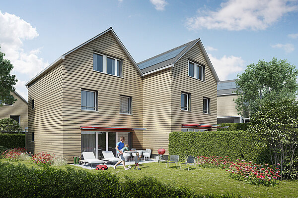 Aussenansicht zweier Häuser des Projekts Bölli Süd mit Garten